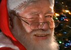 SantaClaus  Santa Claus winks as he poses by a Christmas tree.  PHOTO-ILLUSTRATION for Santa Claus Q&#38;A