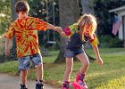 RollerbladingKids--FIN  Parker Scott, 9, left, helps his sister Hammon, 6, keep her balance as the two rollerblade together down the sidewalk in front of the family&#39;s home in Spartanburg Wednesday evening, 4-20-05.  (NOTE: Stand-alone FEATURE)