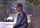 WaitinginRain.JPG  Nesbitt Harris, 78, finds a comfortable spot under a tree, out of the rain, as he waits for his wife to walk her home from church (Macedonia Baptist Church on Daniel Morgan Ave.) in Spartanburg Sunday afternoon, September 2, 2001. (AP Photo/Spartanburg Herald-Journal/Tim Kimzey).