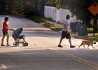 dog&#38;babywalk FIN  Chris and Audrey Brooks take their son Simon, 1 month, and their English Bulldog &#34;Albus&#34; out for a stroll Thursday afternoon, 9-23-04, near their home in Converse Heights.  (NOTE: Stand-alone Feature)