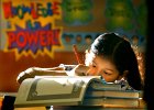 Back To School  Anita Sanchez, 9, writes her name in a newly-acquired stack of textbooks in Lucile Kershaw&#39;s fourth grade class at Arcadia Elementary School in Spartanburg, SC on the first day back to school Thursday morning, August 14, 2003.  (AP Photo/Spartanburg Herald-Journal/Tim Kimzey)