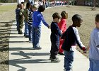 hugschool2.JPG  574 students in pre-kindergarten to the fifth grade hold hands as they form a circle around Anderson Mill Elementary School in Spartanburg Wednesday. The school was celebrating &#34;i love my school&#34; during the month of February.