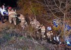 wreckravine.jpg  Spartanburg city firefighters, public safety officers, and Spartanburg EMS form a chain to lift a victm entrapped in a vehicle in a ravine off of King Line Road near Union St. in Spartanburg around 8p.m. Saturday night. : PUBDATE_2001_02_10_hj_b_??